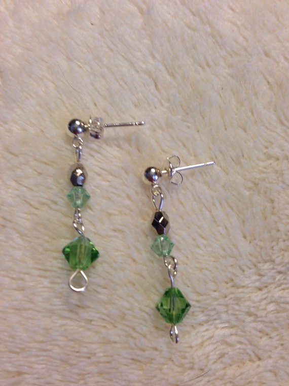 Genuine Swarovski crystal earrings in green on hypoallergenic