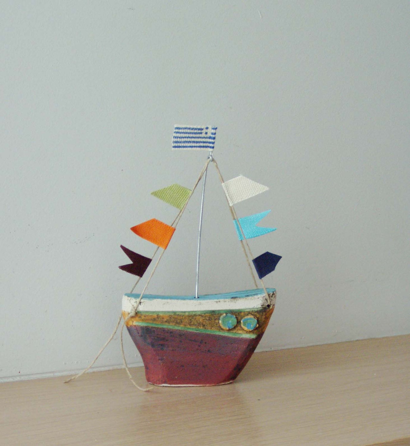 Ceramic sailing boat with colourful flags stoneware clay boat