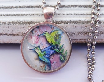 Elegant necklace in silver with magical hummingbird motif in front of ...
