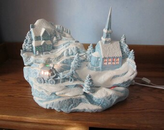 Ceramic Christmas Village with Church, house, and horse and carriage