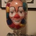 Creepy Clown Doll Head in glass