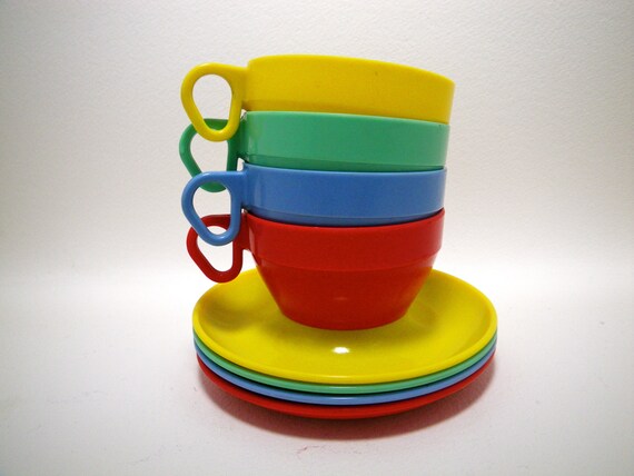 plastic tea cups with saucers