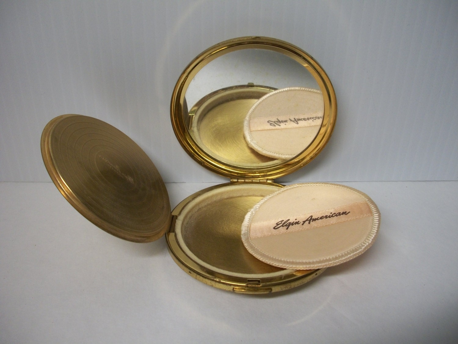 Vintage Mid Century Compact Goldtone Elgin American with powder puff
