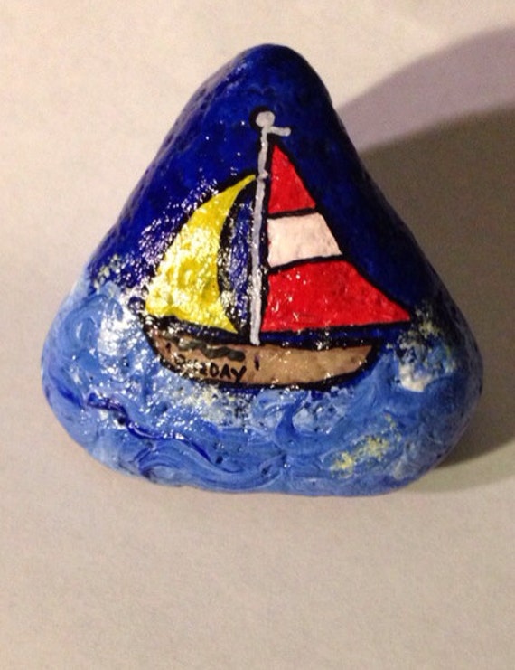 sailboat rock painting