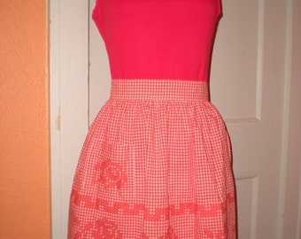 Handmade vintage orange gingham cross stitched apron Size small 17" waist band. Rose pattern