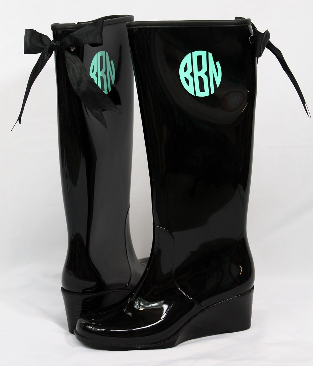 monogram plaque long leather boots