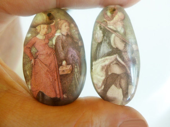 The Travelers. Resin charm pair.
