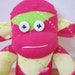 Argyle sock monkey plush doll - magenta, lime green, and pale yellow