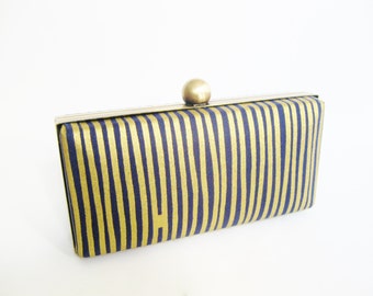 gold and navy clutch