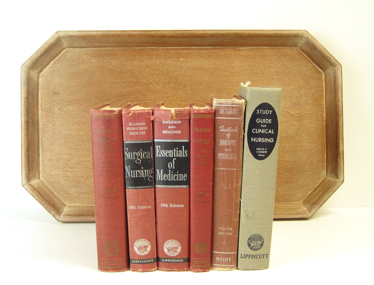 6 nursing textbooks vintage 1950s medical texts red and gray book stack illustrated