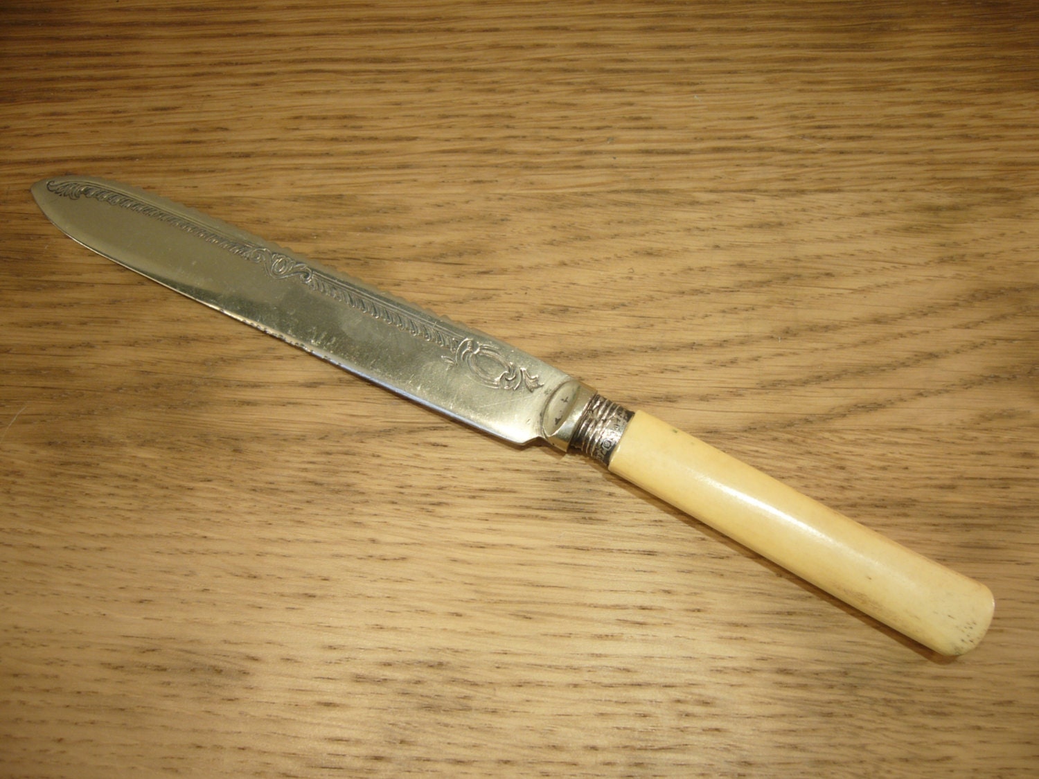 Vintage 1920s cake or bread knife with engraved silver plated