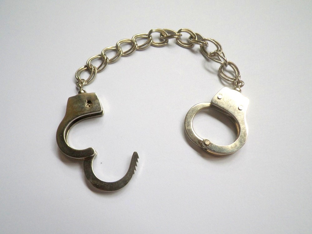 The Submissive Charm Bracelet: functional mini handcuffs