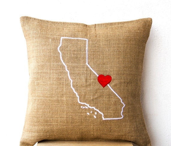 Lovely Things with Beads State in Words A state isn't just where you come from, or where you are making a new home for yourself--it's part of who you are. Designer Tracy Gemme 's location-loving pillows celebrate that complex attachment by bringing together cheerful typography, eco-friendly materials, familiar map silhouettes and straight-up, huggable pleasure.