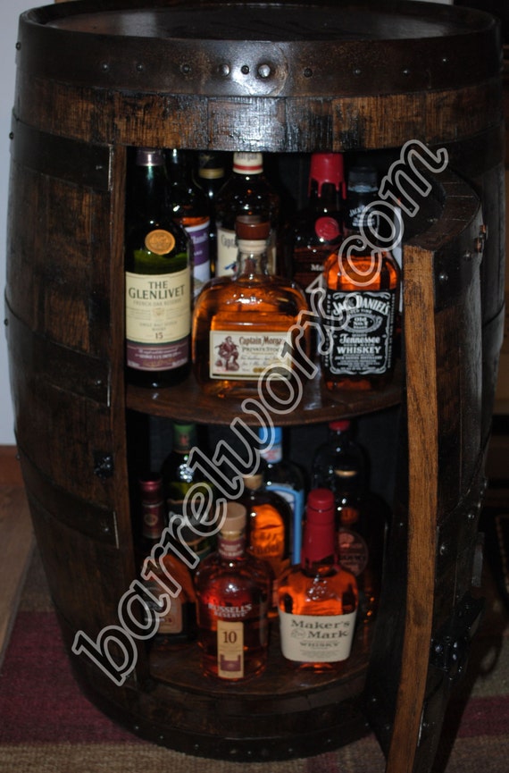 whiskey barrel liquor with double lazy susans.