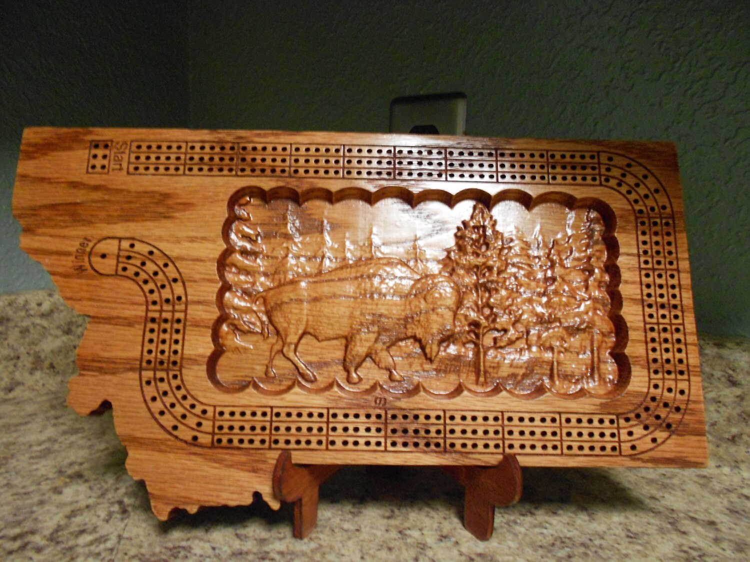Montana shaped handmade three track cribbage board with a