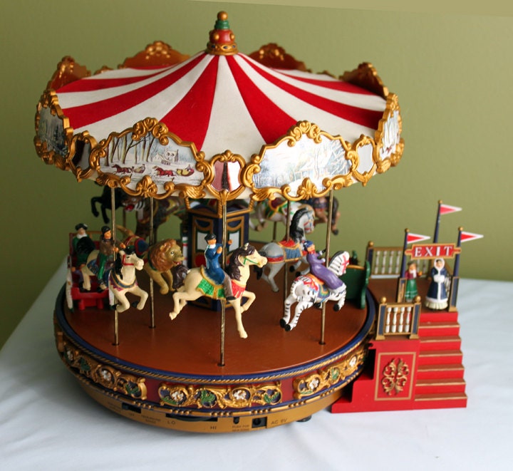 Carousel. Moving Carousel. Resin Figurines of Horses Lions