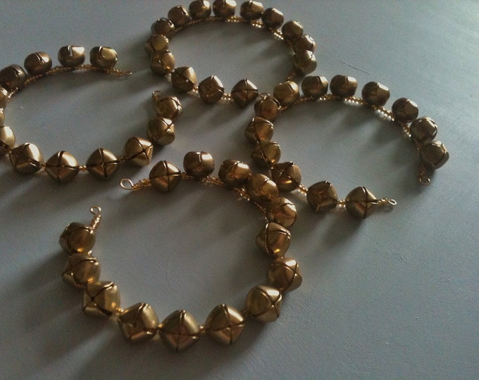 brass bells and gold glass stacking memory wire bracelet