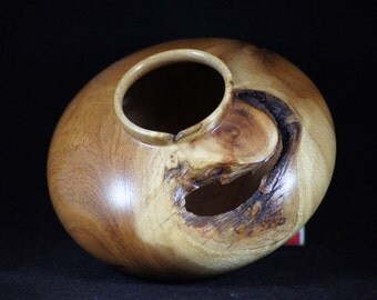 Artistic wood bowl of Mesquite wood. 2 1/2 inches high 4 3/4 inches diameter.