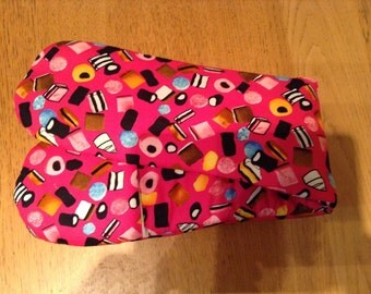 Bright pink liquorice allsorts print oven glove