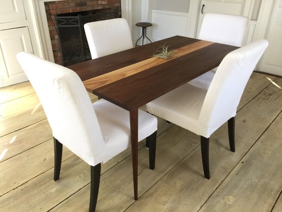 Mid century modern dining table, black walnut & ash with tapered wood legs.