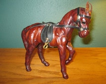 leather covered horse figurine