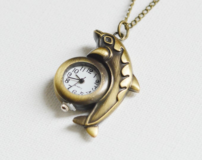 SALE! Once in the Ocean Pendant in the shape of a Dolphin with a clock, metal brass, Nautical