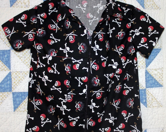 HALF PRICE ** Boys Pirate print Medium size Zip Front Shirt. Chest pocket. Crossbones and skulls on black background.