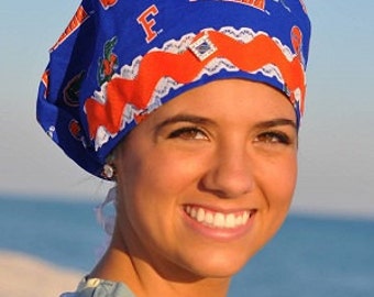 Women's scrub hat made from Gator Blue Univ of Florida fabric with Lace and Ric Rac trim