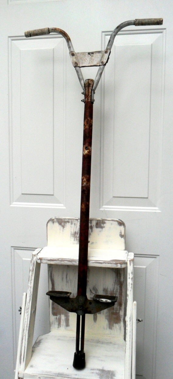 vintage metal pogo stick rusty metal decor by DownSouthChicDecor