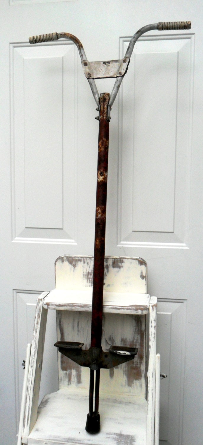 vintage metal pogo stick rusty metal decor by DownSouthChicDecor