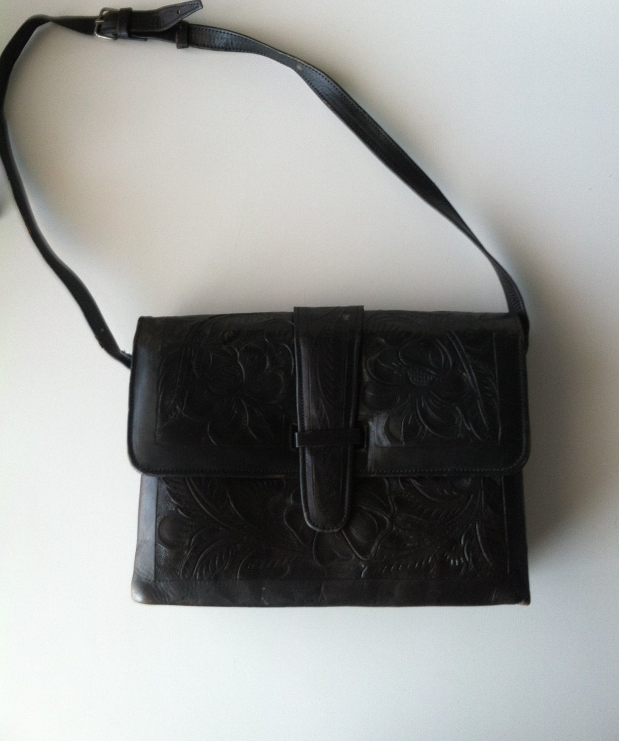 black tooled leather bag