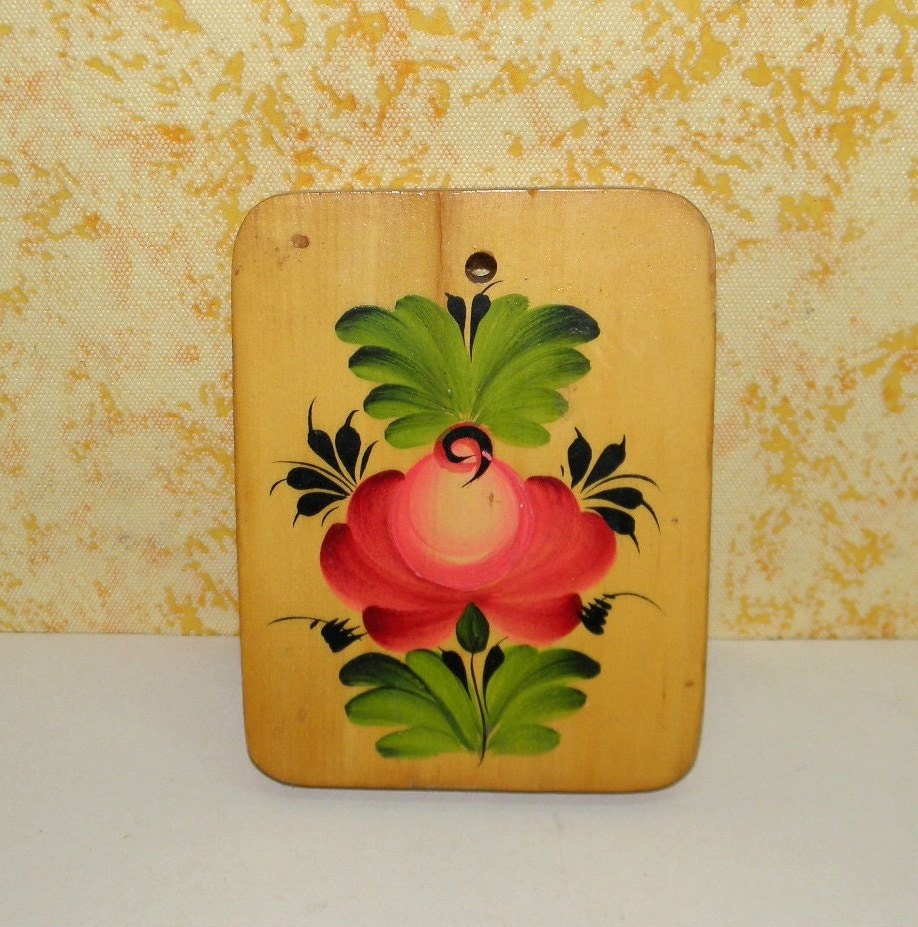 Vintage cutting board with a painting on wood . Chopping board for