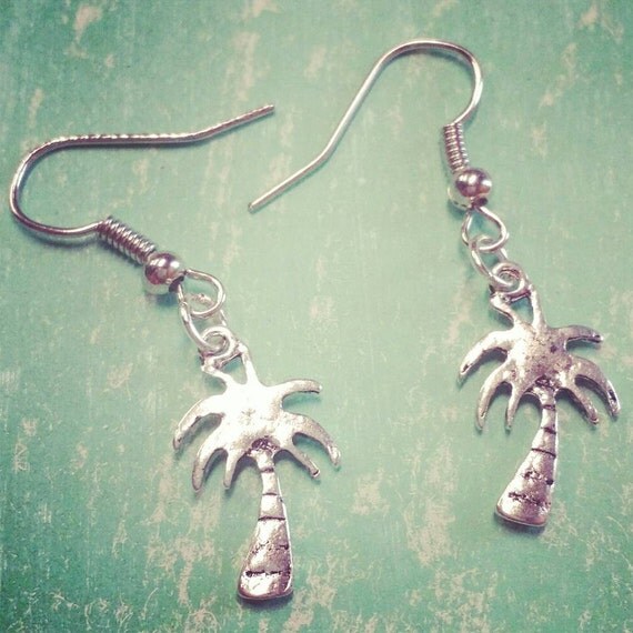 Items similar to Rustic silver palm tree earrings on Etsy