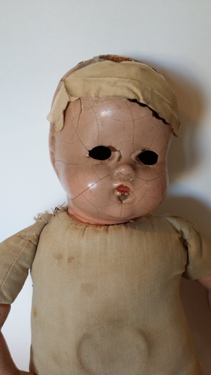 creepy wooden doll