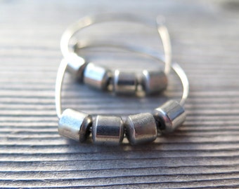 silver hoop earrings. hypoallergenic niobium wire hoops. modern hematite jewelry. silver earings.