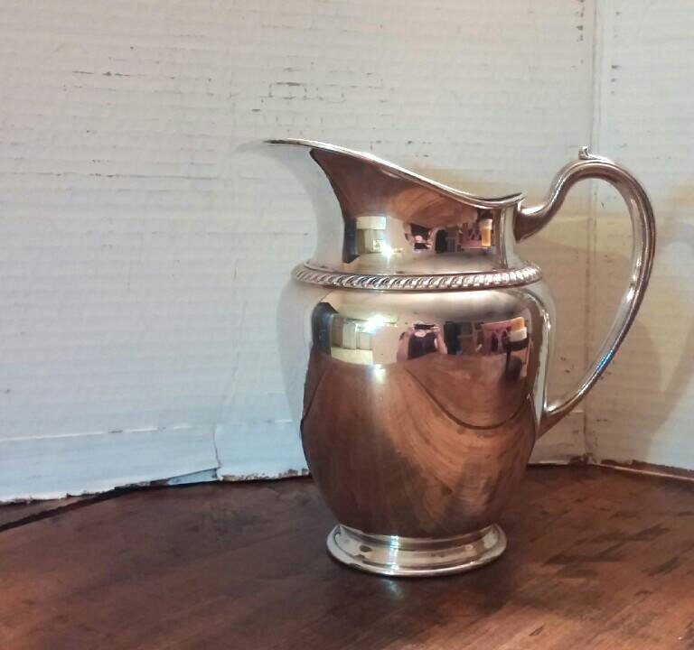 vintage silver water pitcher marked Fiesta Oneida by