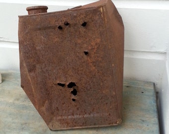 Rusty tin can, bullet holes, target practice can, rusty gas can, old