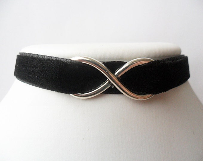 Black velvet choker necklace with Infinity symbol and a width of 3/8"inch.