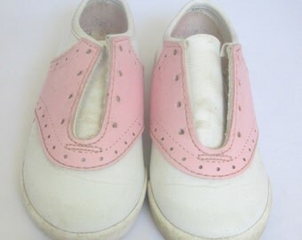 pink and white saddle shoes