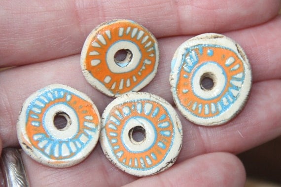 A pair of orange and blue and natural and rustic earthy ceramic disc beads connectors; nr. B94