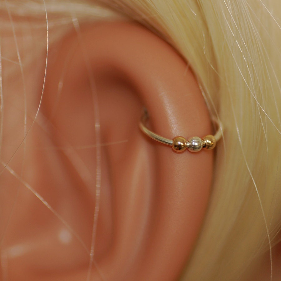 Cartilage hoop earring Cartilage Earrings From feminine flowers to classic silver hoops, Claire's range of cartilage earrings to show off your unique piercings & are easily changeable for a different look. Our collection of colorful and vibrant hoops and studs are versatile and stylish.