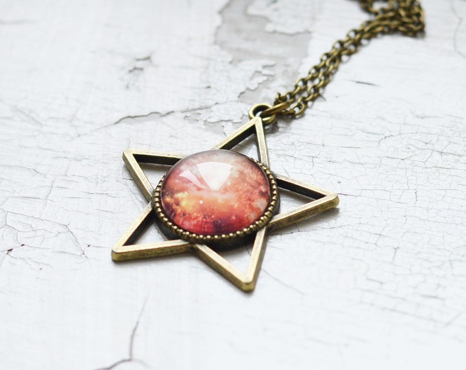 GALAXY // Pendant in the form of a star of metal brass with the image of Space under glass // Space, World // Pink, Red, Orange // Fashion