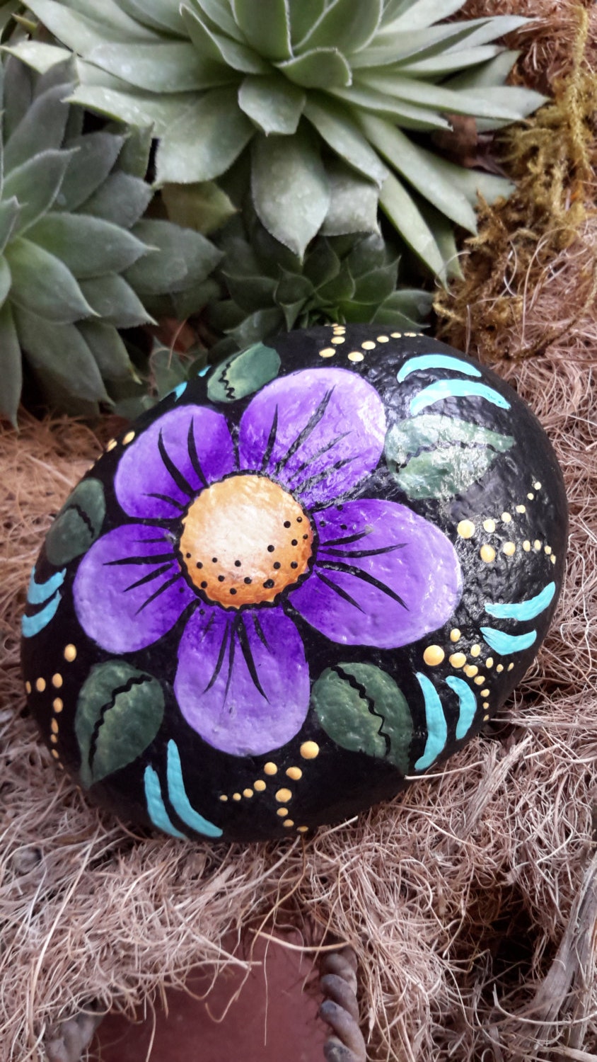 Painted rock garden rock with purple flower plant marker