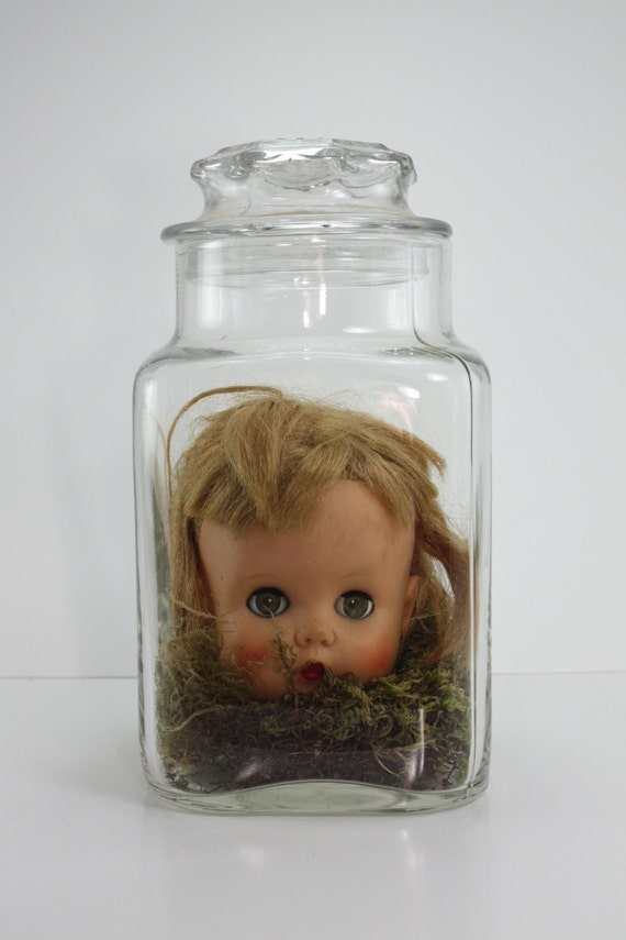 doll heads in jars