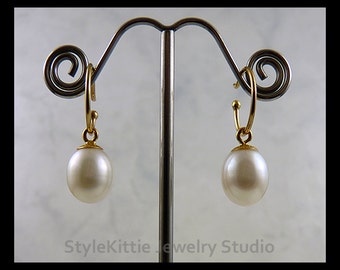 Items similar to White freshwater pearl earrings, gold bead spacers
