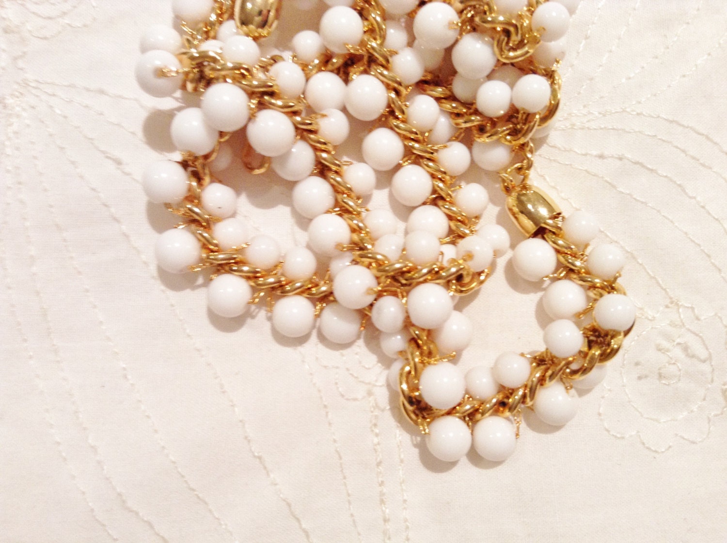 Gold and white enamel bead necklace with gold clasp from the 70s