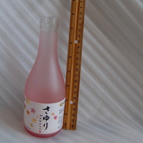 Light pink frosted glass empty Sayuri Nigori Sake bottle