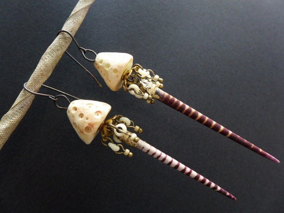 Spinning. Rustic assemblage earrings with urchin spines.