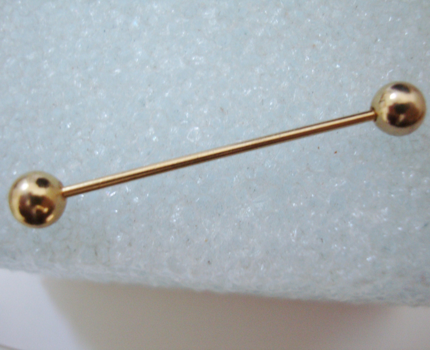 SHIRT COLLAR STAY is about 1 3/4 inch long.. . goldtoned metal