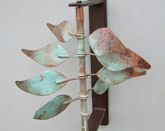 Wind sculpture "Style Leaves" mounts to wall, post, fence or any vertical surface and turns in the wind. Sale price!